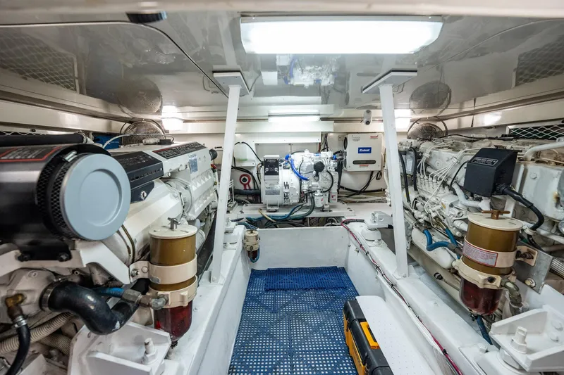 Business Yacht Photos Pics Engine room of a 2001 Post 42 yacht, featuring dual engines and clean layout.