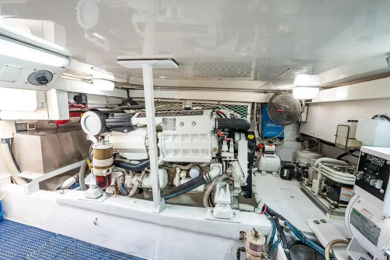 Business Yacht Photos Pics Engine room of a 2001 Post 42 yacht, featuring mechanical equipment and systems.