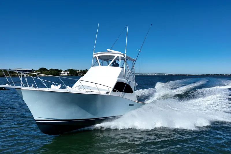 Business Yacht Photos Pics 2001 Post 42 yacht cruising on open water under clear blue sky.