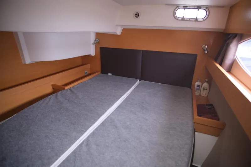 Northern Lynx Yacht Photos Pics 2011 Fountaine Pajot Salina 48 Evolution Maestro cabin interior with bed and window.