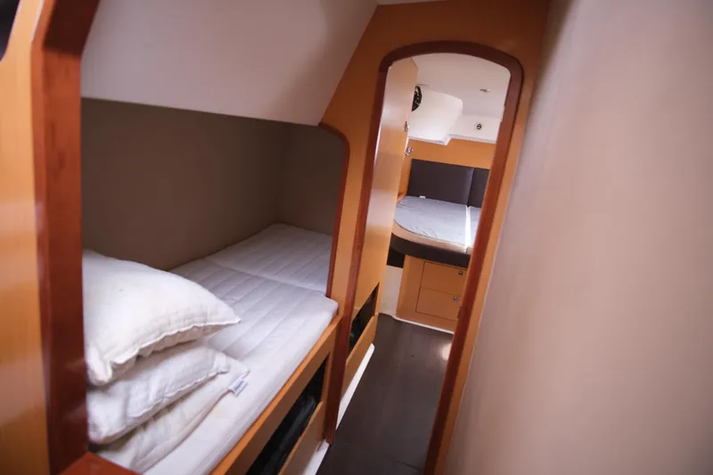 Northern Lynx Yacht Photos Pics Interior of 2011 Fountaine Pajot Salina 48 Evolution Maestro, featuring cozy cabin beds.
