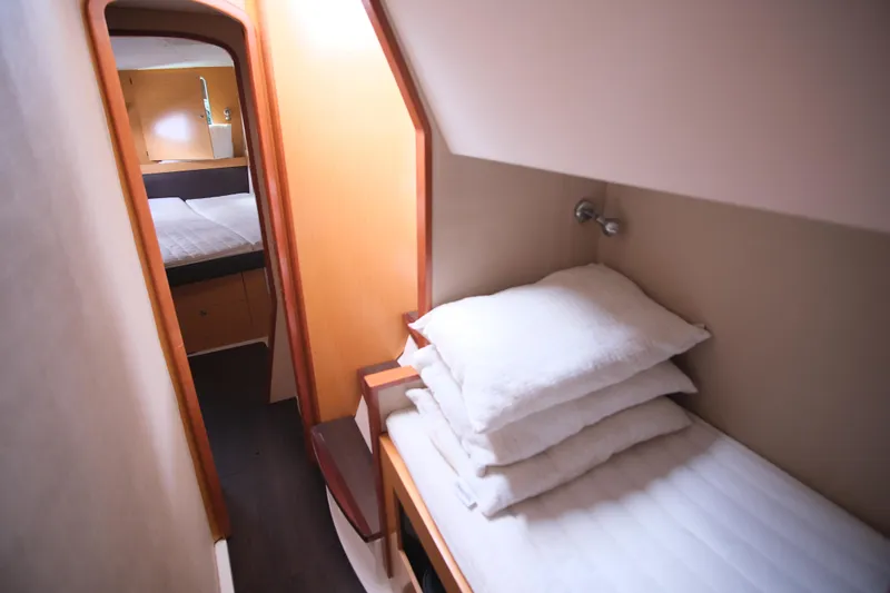Northern Lynx Yacht Photos Pics Interior cabin of 2011 Fountaine Pajot Salina 48 Evolution Maestro, featuring cozy bedding.