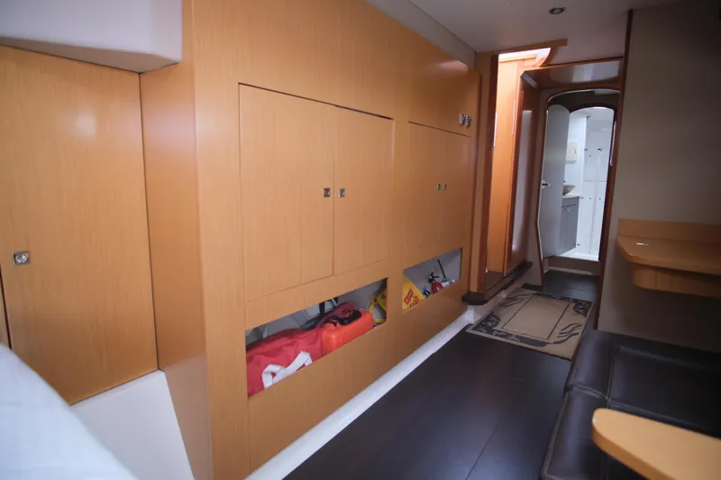 Northern Lynx Yacht Photos Pics Interior of 2011 Fountaine Pajot Salina 48 Evolution Maestro yacht, featuring wooden cabinetry.
