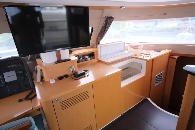 Northern Lynx Yacht Photos Pics Interior of 2011 Fountaine Pajot Salina 48 Evolution Maestro with TV and storage.