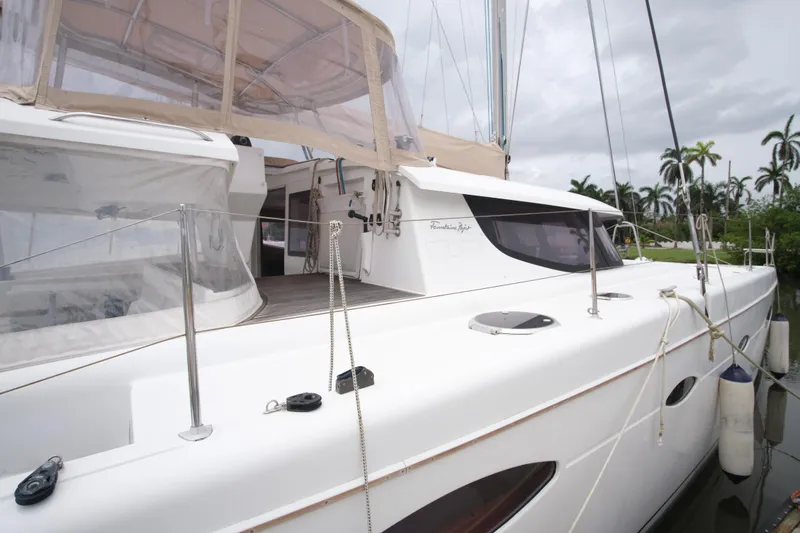 Northern Lynx Yacht Photos Pics Fountaine Pajot Salina 48 Evolution Maestro 2011 catamaran docked, featuring sleek design and spacious deck.