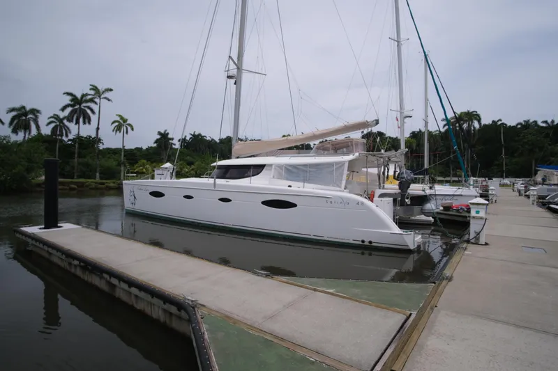 Northern Lynx Yacht Photos Pics Fountaine Pajot Salina 48 Evolution Maestro 2011 catamaran docked at a marina.