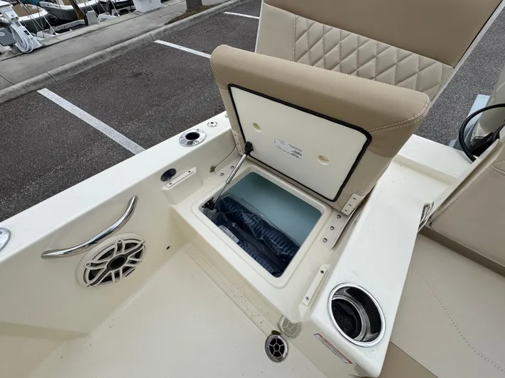  Yacht Photos Pics 2025 Scout 261 XSS boat interior with storage compartment and speaker.