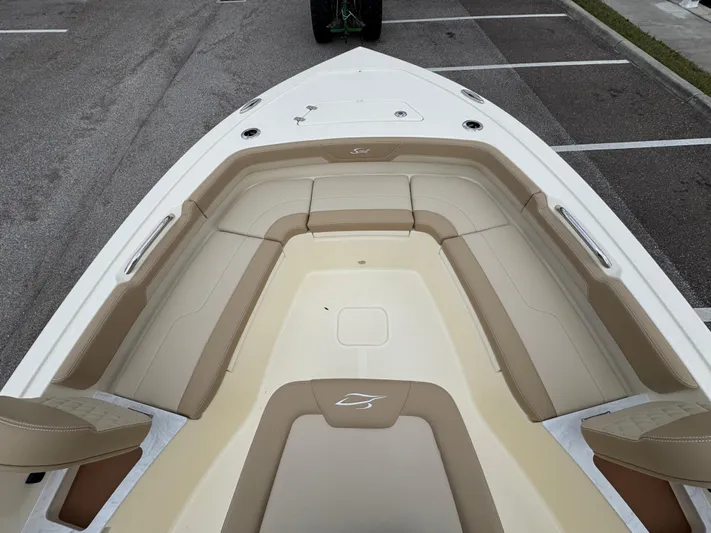  Yacht Photos Pics 2025 Scout 261 XSS boat interior with beige seating and spacious deck.