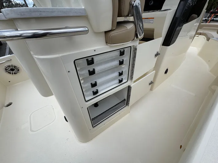  Yacht Photos Pics 2025 Scout 261 XSS boat interior with storage compartments and seating.