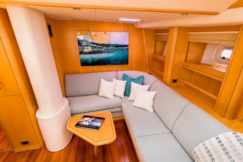 Ravenclaw Yacht Photos Pics Luxurious interior of 2007 Oyster 82/08 yacht with cozy seating and modern decor.