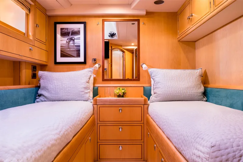 Ravenclaw Yacht Photos Pics Luxurious 2007 Oyster 82/08 yacht cabin with twin beds and elegant wood finish.