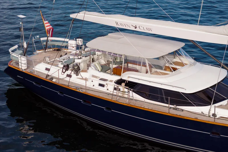 Ravenclaw Yacht Photos Pics Luxury 2007 Oyster 82/08 yacht with sleek design and spacious deck on calm waters.