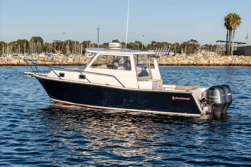 Caroline II Yacht Photos Pics 2021 NorthCoast 285 HT boat on water, featuring dual Yamaha engines.