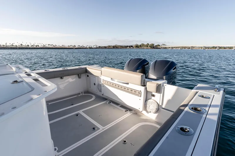 Caroline II Yacht Photos Pics 2021 NorthCoast 285 HT boat deck with dual engines on calm water.