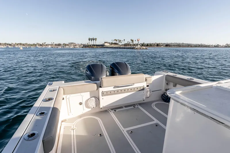 Caroline II Yacht Photos Pics 2021 NorthCoast 285 HT boat on water, featuring spacious deck and dual engines.