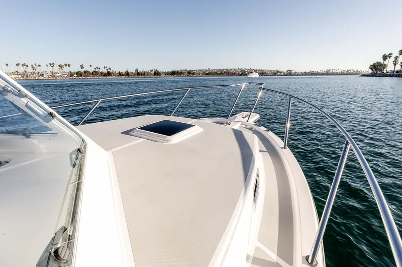 Caroline II Yacht Photos Pics 2021 NorthCoast 285 HT boat cruising on calm waters under clear sky.