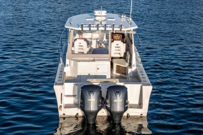 Caroline II Yacht Photos Pics 2021 NorthCoast 285 HT boat with dual 300 horsepower engines on open water.