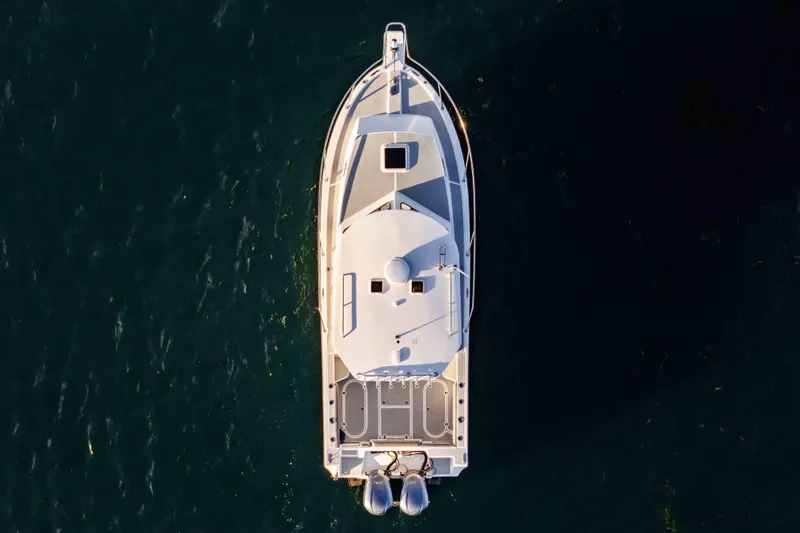 Caroline II Yacht Photos Pics Overhead view of 2021 NorthCoast 285 HT boat on dark water.