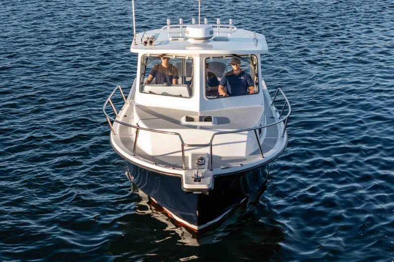 Caroline II Yacht Photos Pics 2021 NorthCoast 285 HT boat cruising on open water.