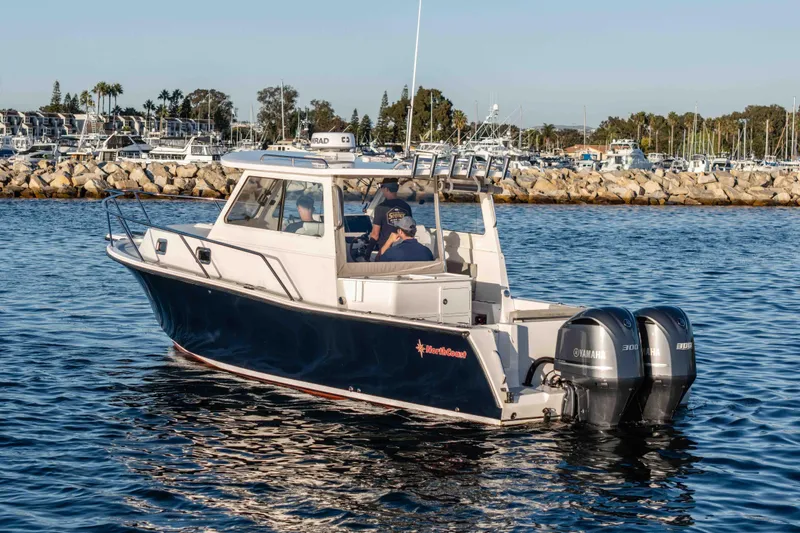 Caroline II Yacht Photos Pics 2021 NorthCoast 285 HT boat with dual Yamaha engines on calm water.