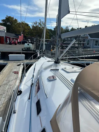  Yacht Photos Pics 2005 Hunter 38 sailboat docked at marina, showcasing deck and rigging.