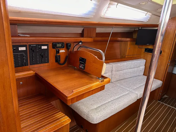  Yacht Photos Pics Interior of 2005 Hunter 38 sailboat with wood finish and navigation equipment.