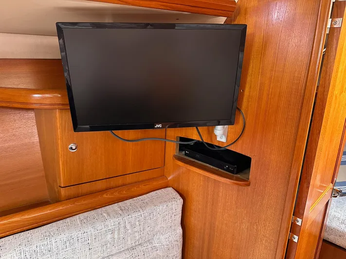  Yacht Photos Pics Flat-screen TV mounted on wooden interior of 2005 Hunter 38 sailboat.
