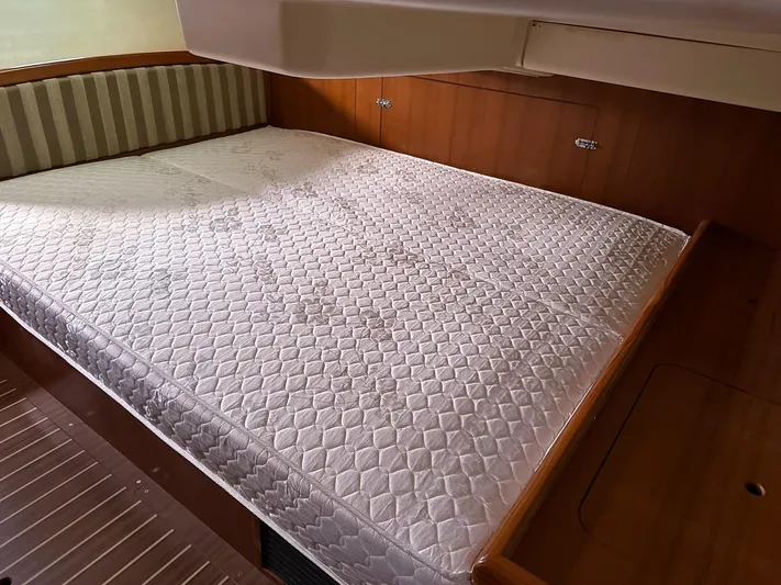  Yacht Photos Pics Cabin interior of 2005 Hunter 38 sailboat with a spacious bed.