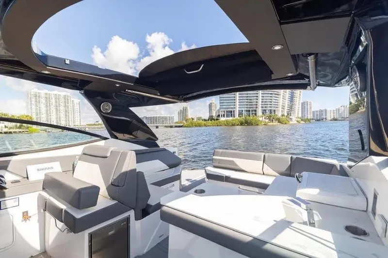  Yacht Photos Pics 2021 Cruisers Yachts 38 GLS OB interior with waterfront cityscape view.