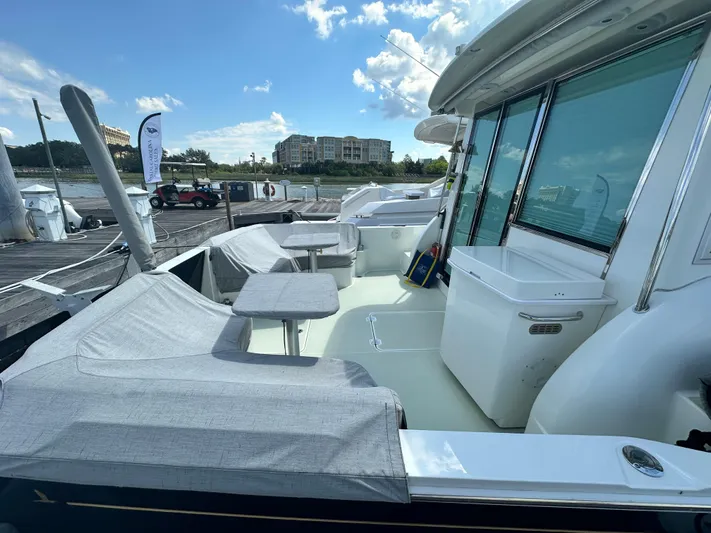 Katahdin Yacht Photos Pics 2020 Back Cove 41 yacht with covered seating area and marina view.