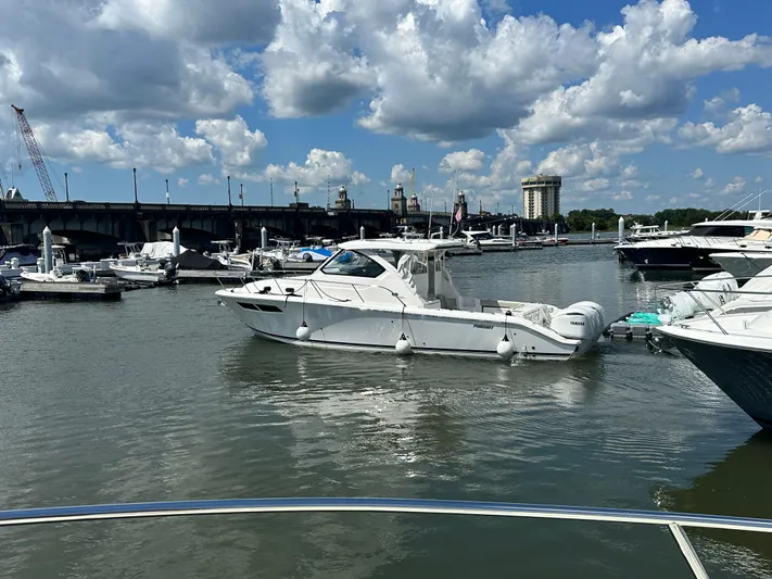 Katahdin Yacht Photos Pics 2020 Back Cove 41 yacht docked in a marina under a partly cloudy sky.