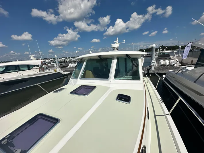 Katahdin Yacht Photos Pics 2020 Back Cove 41 yacht docked under a bright blue sky with clouds.
