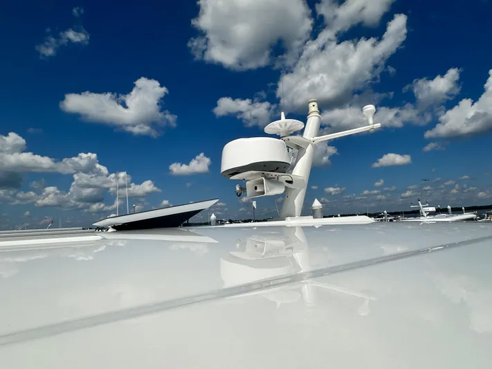 Katahdin Yacht Photos Pics 2020 Back Cove 41 yacht radar against a vibrant blue sky with clouds.