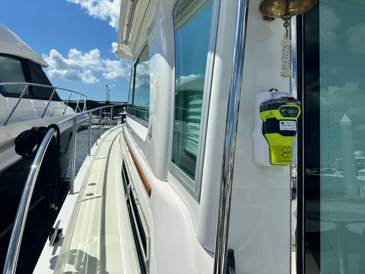 Katahdin Yacht Photos Pics 2020 Back Cove 41 yacht docked, showcasing sleek design and safety equipment under a clear sky.