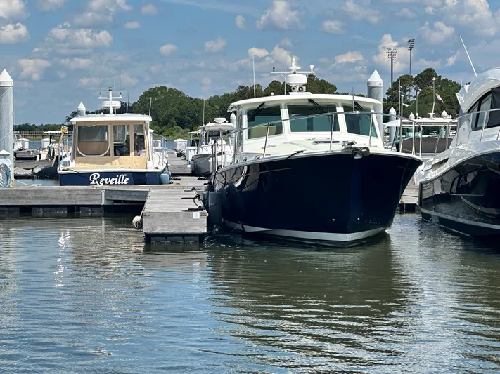 Katahdin Yacht Photos Pics 2020 Back Cove 41 yacht docked at marina under blue sky.