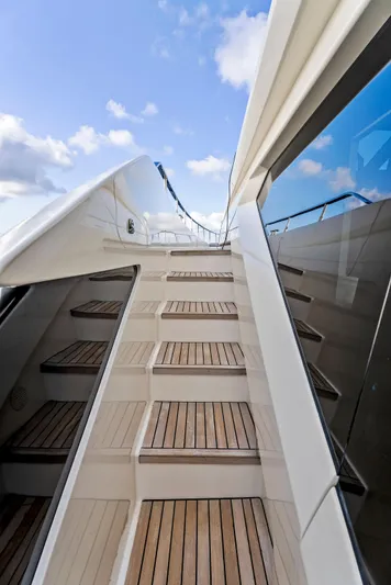  Yacht Photos Pics Staircase on 2020 Ferretti Yachts 920, leading to upper deck under blue sky.