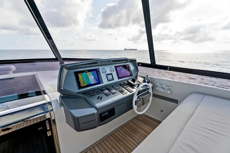  Yacht Photos Pics Helm of 2020 Ferretti Yachts 920 with ocean view, featuring modern navigation equipment.