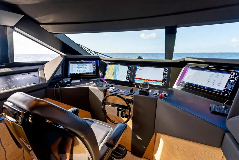  Yacht Photos Pics Cockpit of 2020 Ferretti Yachts 920 with advanced navigation systems and ocean view.