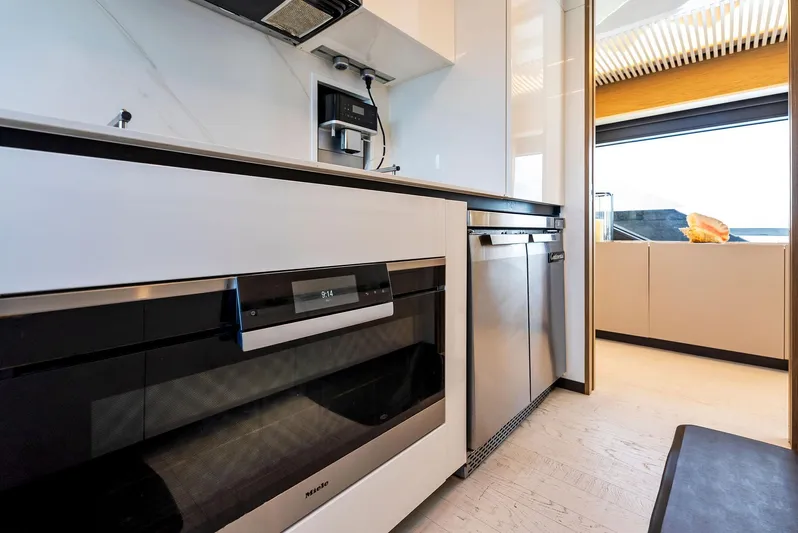  Yacht Photos Pics Modern kitchen interior on 2020 Ferretti Yachts 920, featuring sleek appliances and ocean view.
