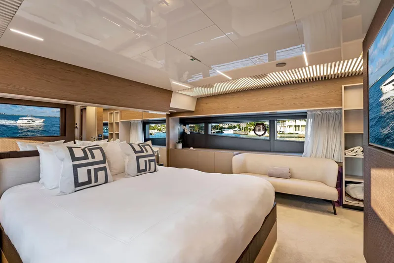 Yacht Photos Pics Luxurious bedroom interior of 2020 Ferretti Yachts 920, featuring elegant design and large windows.