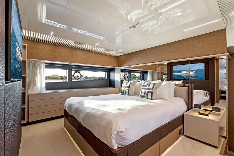  Yacht Photos Pics Luxurious bedroom interior on 2020 Ferretti Yachts 920, featuring modern design and large windows.