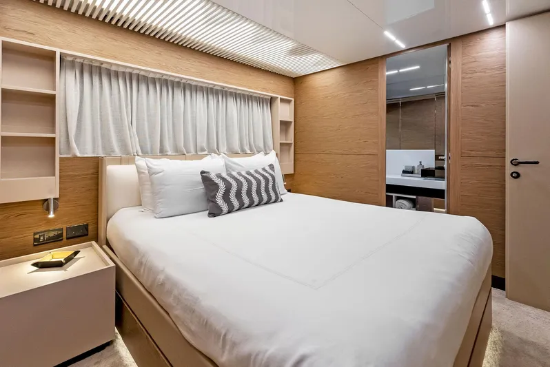  Yacht Photos Pics Luxurious bedroom interior of 2020 Ferretti Yachts 920, featuring modern design and elegant furnishings.