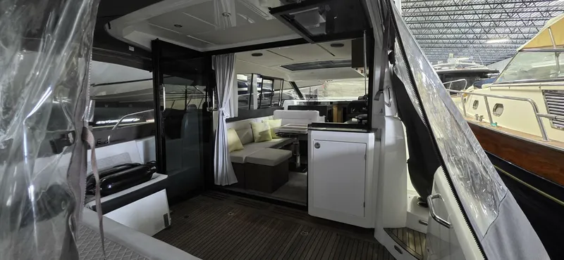  Yacht Photos Pics Interior view of 2020 Jeanneau NC 37 yacht, featuring modern seating and sleek design.