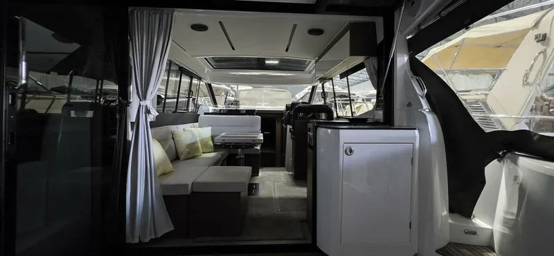  Yacht Photos Pics Interior of 2020 Jeanneau NC 37 yacht, featuring modern seating and sleek design.