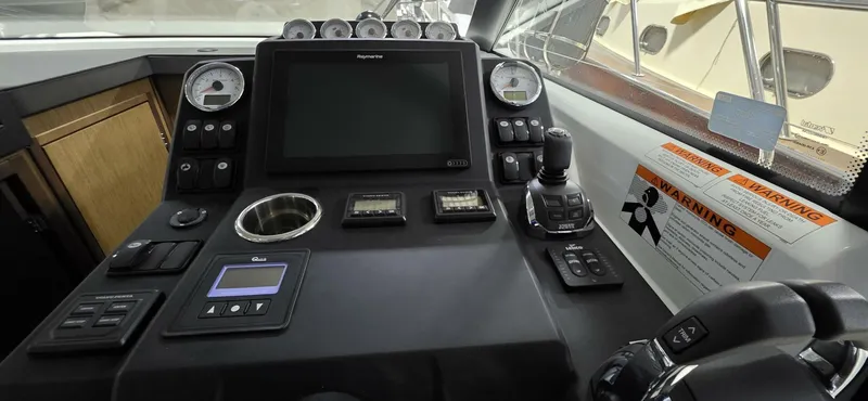  Yacht Photos Pics Control panel of 2020 Jeanneau NC 37 boat with navigation equipment and gauges.