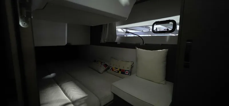  Yacht Photos Pics Interior cabin of 2020 Jeanneau NC 37 yacht, featuring cozy seating and modern design.