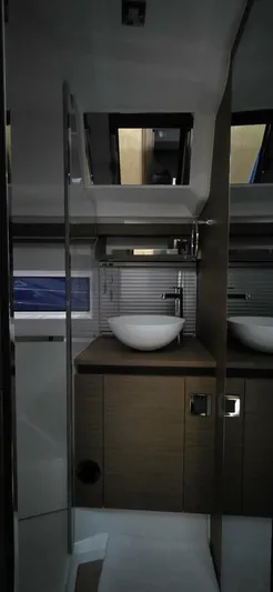 Yacht Photos Pics Interior of 2020 Jeanneau NC 37 yacht bathroom with modern sink and cabinetry.