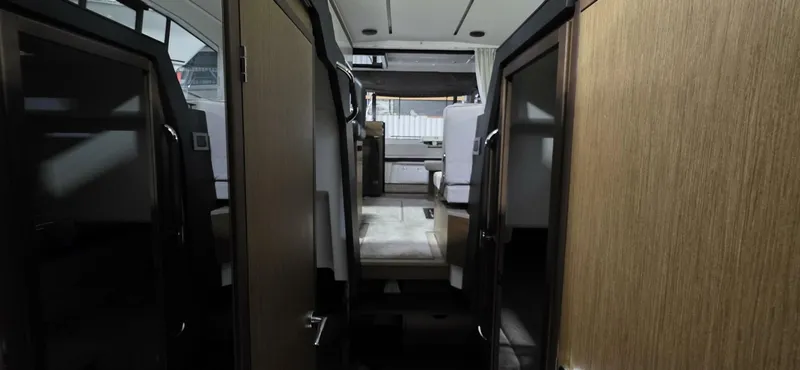  Yacht Photos Pics Interior view of 2020 Jeanneau NC 37 yacht, featuring modern design and wood finishes.