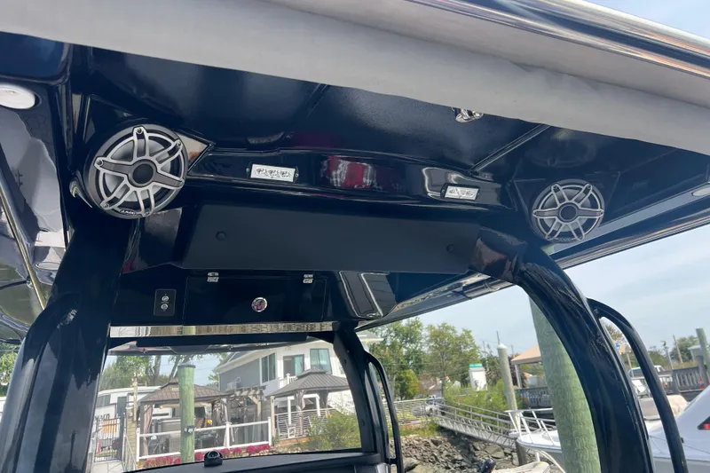  Yacht Photos Pics 2021 Fountain 39 NX boat interior with speakers and control panel.