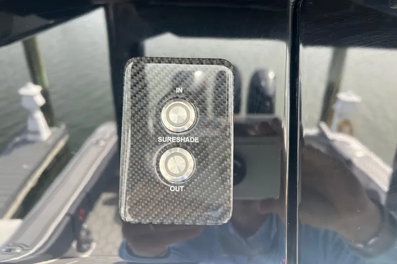 Yacht Photos Pics Control panel for SureShade on 2021 Fountain 39 NX boat, featuring "In" and "Out" buttons.